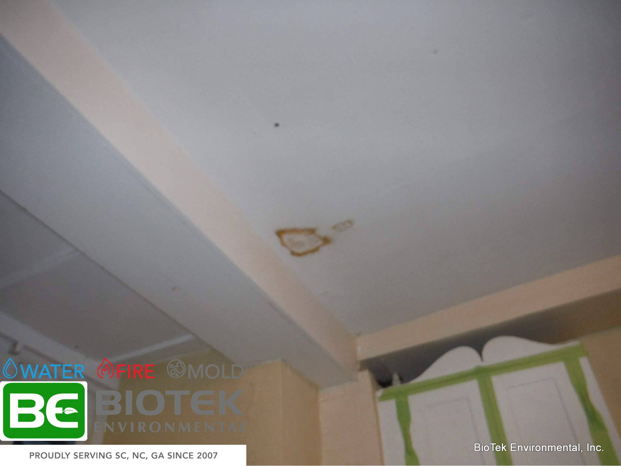 Roof leaks resulting in a brown spot on the ceiling drywall